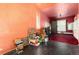 Versatile room with ceiling fan and red carpet, providing a blank canvas for renovations and customization at 2410 W 36Th Ave, Denver, CO 80211