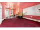 Spacious room with a ceiling fan, and red carpet, offering plenty of potential with lots of TLC at 2410 W 36Th Ave, Denver, CO 80211