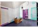 Unique room featuring colorful doors and trim, along with personal items stored in boxes at 2410 W 36Th Ave, Denver, CO 80211
