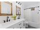 Basement bathroom with a bathtub and double vanity at 8006 S Settlers Dr, Morrison, CO 80465