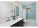 Charming bathroom with double vanity, herringbone tile, and a bathtub at 8006 S Settlers Dr, Morrison, CO 80465