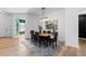 Elegant dining room with hardwood floors and modern chandelier at 8006 S Settlers Dr, Morrison, CO 80465