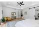 Main bedroom with an ensuite bathroom and great natural light at 8006 S Settlers Dr, Morrison, CO 80465