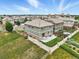 Aerial view of a two-story home with a patio, fenced yard and manicured landscaping at 12554 Hudson Ct, Thornton, CO 80241