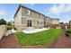 A backyard with a concrete patio, lush green lawn, and well-maintained landscaping at 12554 Hudson Ct, Thornton, CO 80241