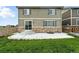 View of backyard with patio, lush green lawn, and well-maintained landscaping at 12554 Hudson Ct, Thornton, CO 80241