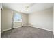 Bedroom with plush carpeting, ceiling fan and window with natural light at 12554 Hudson Ct, Thornton, CO 80241