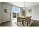Elegant dining room with a modern chandelier and view of the outdoor space at 12554 Hudson Ct, Thornton, CO 80241
