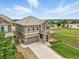 A beautiful two-story home with a well-manicured lawn and an attached two-car garage at 12554 Hudson Ct, Thornton, CO 80241
