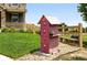 Decorative front yard featuring a vintage filing cabinet and quaint bench at 12554 Hudson Ct, Thornton, CO 80241