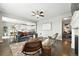 Stylish living room offering an open layout with access to kitchen and dining areas at 12554 Hudson Ct, Thornton, CO 80241