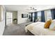 Bright main bedroom with lots of light, TV, carpet flooring, and neutral wall color at 12554 Hudson Ct, Thornton, CO 80241