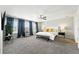 Relaxing main bedroom with large windows, ceiling fan, and neutral tones at 12554 Hudson Ct, Thornton, CO 80241