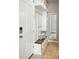 Well-organized mudroom with built-in storage, a bench, hooks, and tiled flooring offers convenient space at 12554 Hudson Ct, Thornton, CO 80241