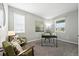 Bright home office space with carpeted floors, two windows and two comfortable chairs, perfect for working from home at 12554 Hudson Ct, Thornton, CO 80241