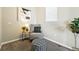 Cozy sitting area featuring a comfortable chair, ottoman, and stylish decor at 12554 Hudson Ct, Thornton, CO 80241
