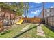 Large backyard with a playset and a fenced perimeter at 1726 N Lafayette St, Denver, CO 80218