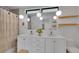 Modern bathroom featuring double sinks, pendant lighting, and sleek white cabinetry at 1726 N Lafayette St, Denver, CO 80218