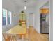 Dining area with a table, chairs, and bench seating by a window at 1726 N Lafayette St, Denver, CO 80218