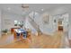 Bright dining room with hardwood floors, complemented by a wooden table with blue chairs at 1726 N Lafayette St, Denver, CO 80218