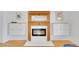 Living room fireplace with a wood mantel and built in shelving at 1726 N Lafayette St, Denver, CO 80218