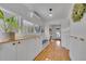 Well-lit hallway with built-in coat bench and storage, leading to other rooms at 1726 N Lafayette St, Denver, CO 80218