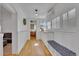 Bright hallway with hardwood floors, coat bench, and built-in storage at 1726 N Lafayette St, Denver, CO 80218