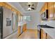 Modern kitchen featuring stainless steel appliances and light wood cabinets at 1726 N Lafayette St, Denver, CO 80218