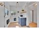 Charming kitchenette with a compact sink, microwave, and shiplap walls at 1726 N Lafayette St, Denver, CO 80218