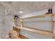 Bright office space with custom built-in shelving and neutral wallpaper at 1726 N Lafayette St, Denver, CO 80218