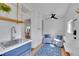 Cozy sunroom with painted brick walls, a ceiling fan, and comfortable seating at 1726 N Lafayette St, Denver, CO 80218