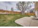 A spacious backyard with a concrete patio and a wood fence at 4032 S Lisbon Way, Aurora, CO 80013