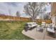 The backyard has a large patio with a white sectional sofa and fenced-in yard at 4032 S Lisbon Way, Aurora, CO 80013