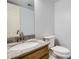 Neutral bathroom with granite countertop vanity and toilet at 4032 S Lisbon Way, Aurora, CO 80013