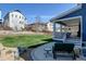 Inviting backyard patio features ample seating, a lush lawn, and scenic views of the surrounding neighborhood at 18315 W 83Rd Dr, Arvada, CO 80007