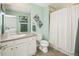 Bathroom with a vanity, toilet, and bathtub/shower combo, with bright walls and decor at 18315 W 83Rd Dr, Arvada, CO 80007