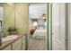 Bathroom with a sink and a doorway that leads into the bedroom area, creating a convenient en-suite setup at 18315 W 83Rd Dr, Arvada, CO 80007