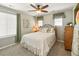 Charming bedroom with a bed, ceiling fan, and a window offering natural light, creating a cozy and inviting space at 18315 W 83Rd Dr, Arvada, CO 80007