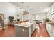 Bright, open kitchen and living area with granite countertops and stainless steel appliances at 18315 W 83Rd Dr, Arvada, CO 80007