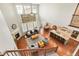 Sun-filled living room featuring a fireplace, soaring ceilings, and an open floor plan at 18315 W 83Rd Dr, Arvada, CO 80007