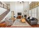 Spacious living room with hardwood floors, fireplace, and comfortable seating arrangement at 18315 W 83Rd Dr, Arvada, CO 80007