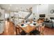 Open-concept living space with a dining table in view, and the stairs in the background at 18315 W 83Rd Dr, Arvada, CO 80007