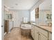 Luxurious main bathroom with granite countertops, soaking tub, and separate shower stall at 18315 W 83Rd Dr, Arvada, CO 80007