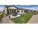 Well-maintained backyard with patio seating, a beautiful lawn, and unobstructed views creating a relaxing outdoor space at 5668 Shadescale Way, Castle Rock, CO 80104
