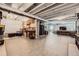 Expansive unfinished basement space with ping pong table, living space, and utility connections for customization at 5668 Shadescale Way, Castle Rock, CO 80104