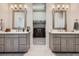 Elegant bathroom with double vanity, undermount sinks, and closet in background at 5668 Shadescale Way, Castle Rock, CO 80104