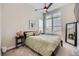 Inviting bedroom featuring a ceiling fan, soft carpet, and plenty of sunlight at 5668 Shadescale Way, Castle Rock, CO 80104