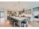 Spacious kitchen with a large island, stainless steel appliances, and modern lighting at 5668 Shadescale Way, Castle Rock, CO 80104