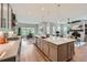 Large kitchen island that opens up to the living room with updated cabinets at 5668 Shadescale Way, Castle Rock, CO 80104