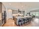 Spacious kitchen with stainless steel appliances, a large island, and an open floor plan at 5668 Shadescale Way, Castle Rock, CO 80104